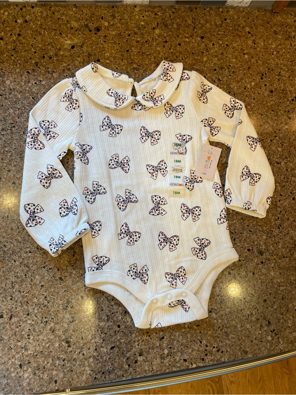Cream Long-Sleeve Baby One-Piece with Bow Print